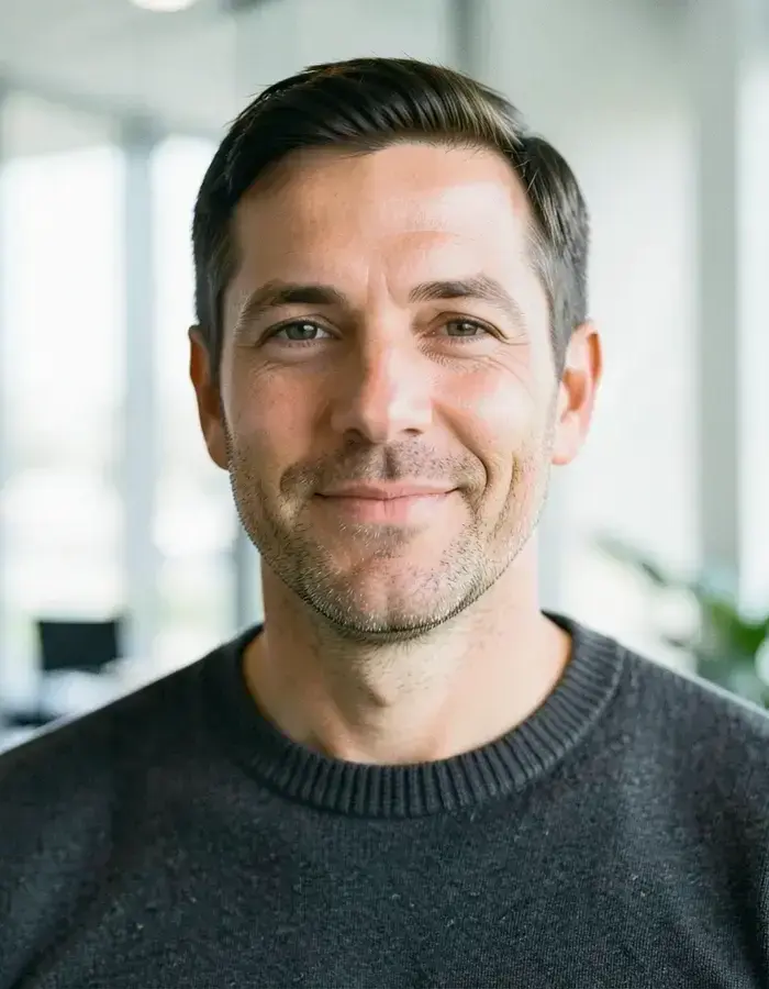 Andrey, CEO of an IT product company, photographed in a bright office
